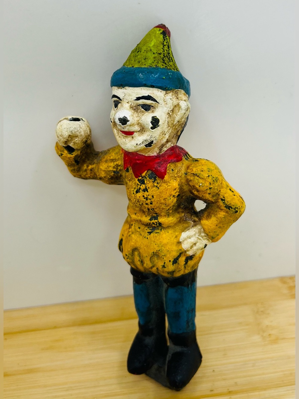 Vintage 1930s clown figure with yellow body , blue pants ,and red bow tie